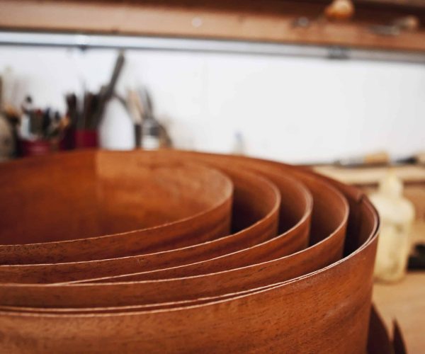 Coil of rusted metal in workshop.